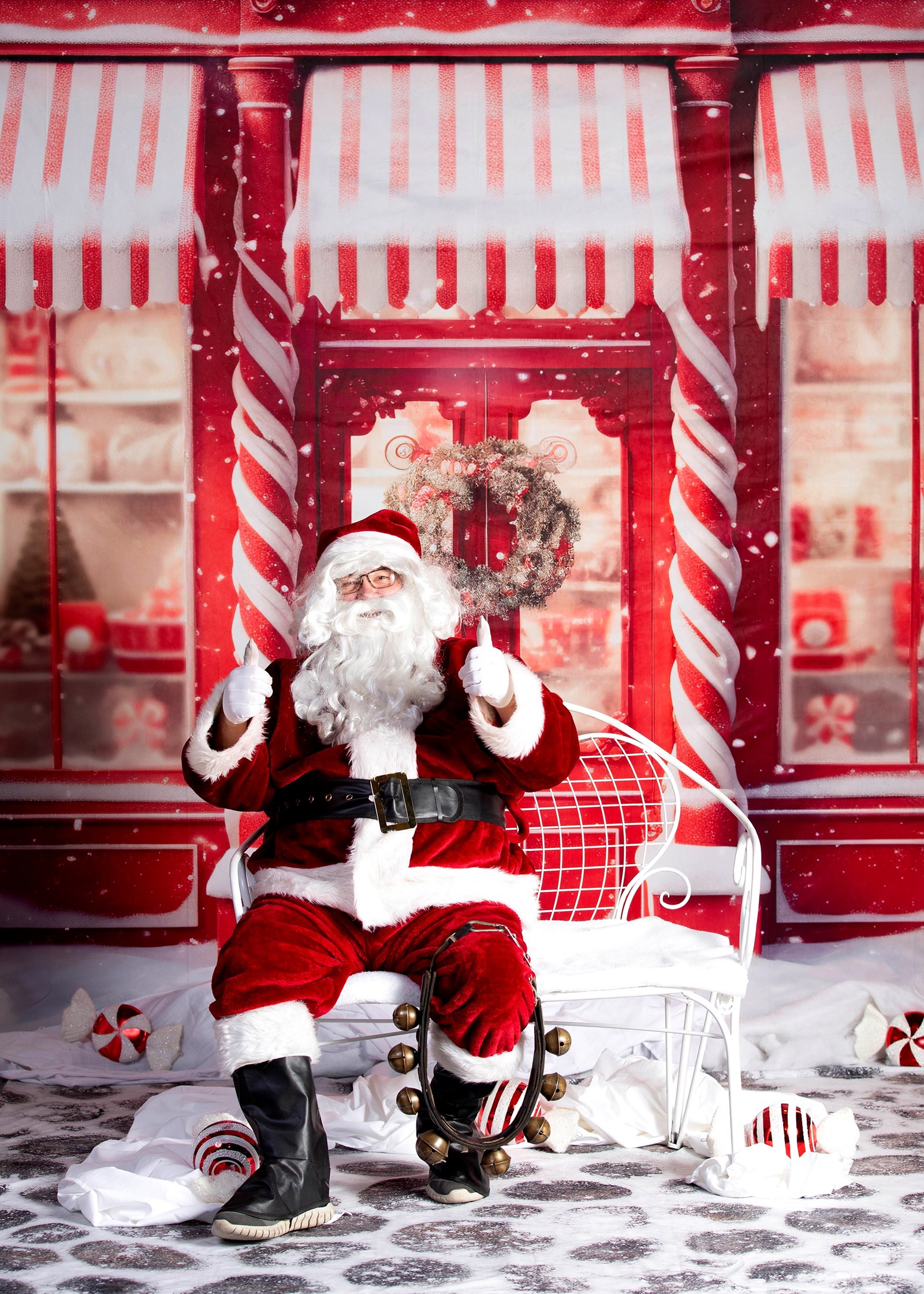 Santa sitting in his chair giving two thumbs up