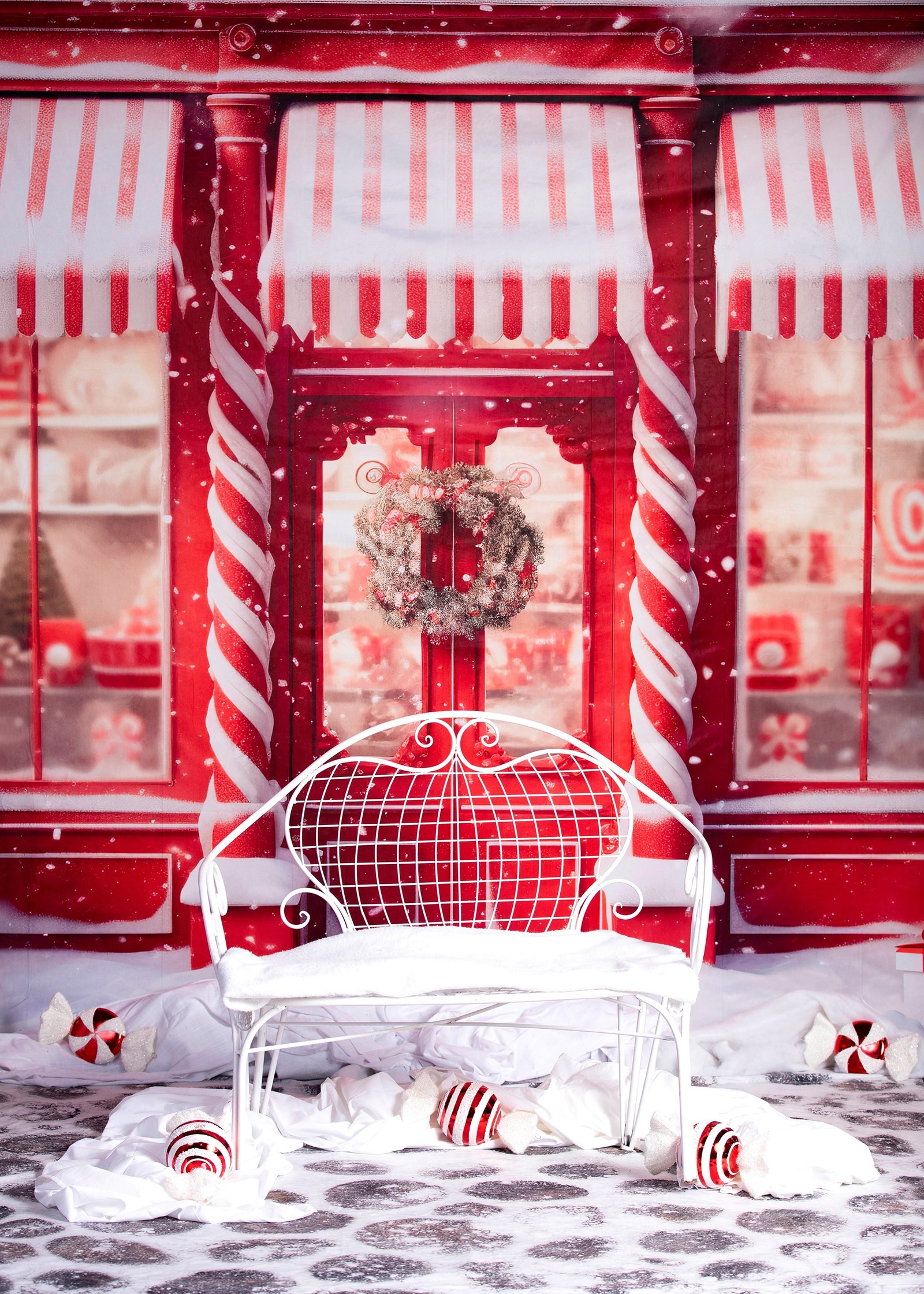 Santa's chair at the north pole - red and white decorated store in the background background with candy cane looking accents