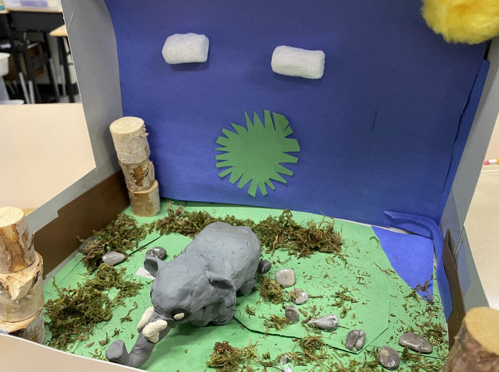 Clay elephant in it's habitat - grassy plain