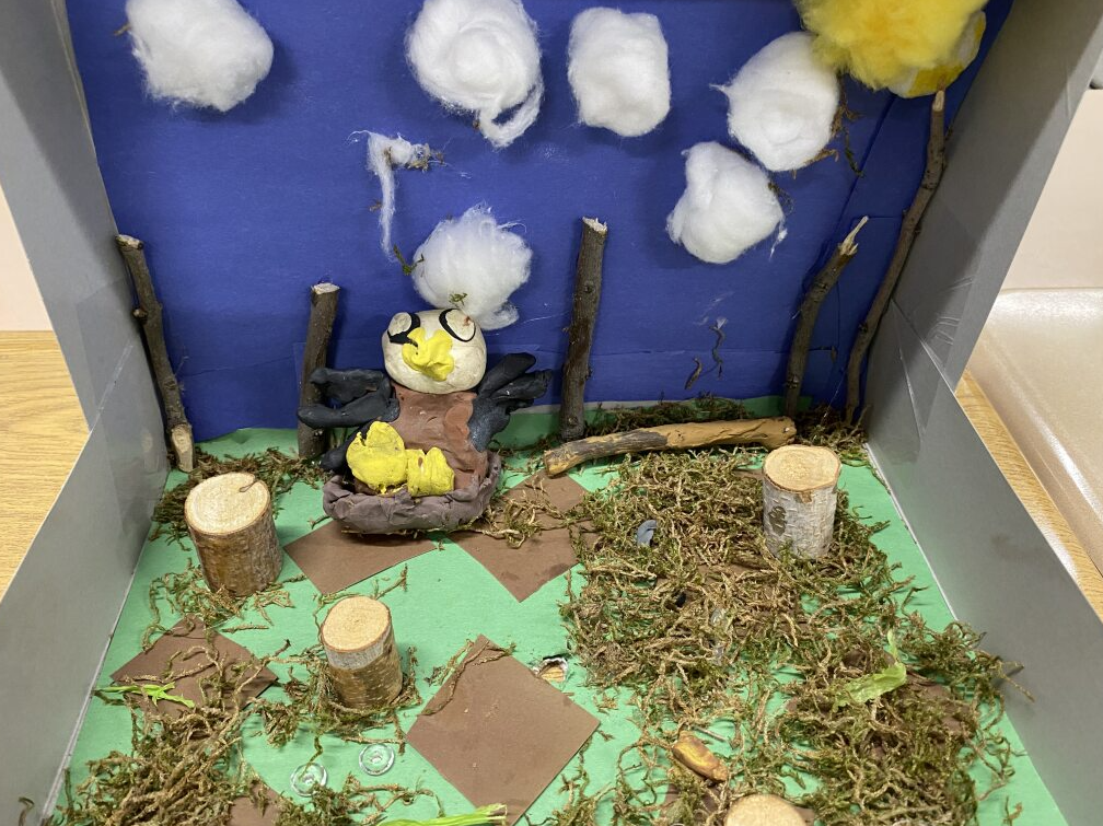 Clay eagle in it's habitat - forest