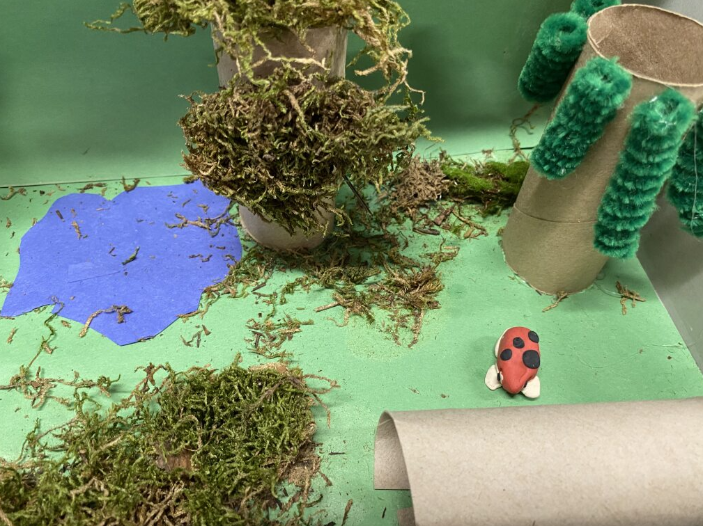 clay frog in it's habitat - pond