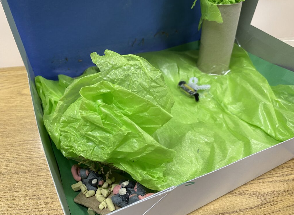 clay mouse in it's habitat - field with it's home underneath