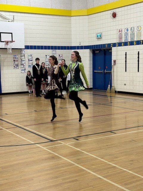 McConnel Irish Dancers perform in a school gymnasium There are 2 dancers
