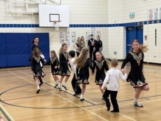 McConnel Irish Dancers perform in a school gymnasium There are approximately 12 dancers