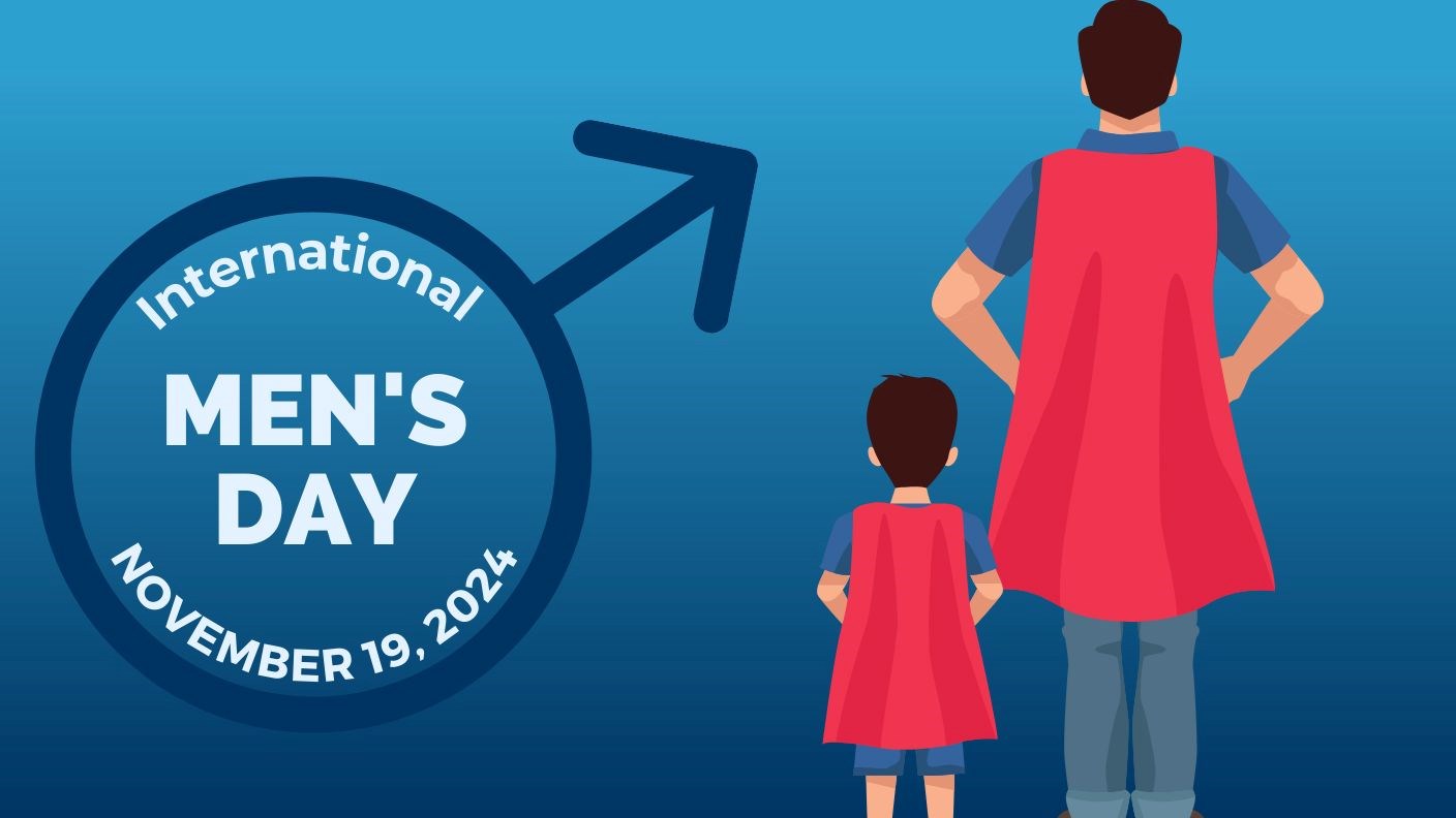Illustration of an adult male standing next to a young male wearing red superhero capes with text that reads “International Men’s Day – November 19, 2024”